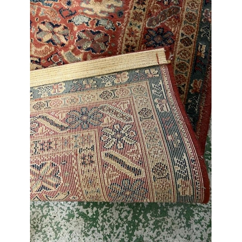 205 - A red ground rug with blue boarder 153cm x 80cm