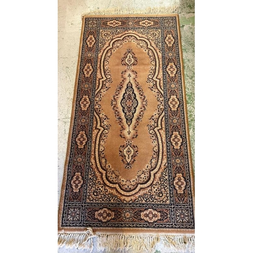 211 - A wool runner, brown grounds with central medallion and geometric boarder 180cm x 90cm