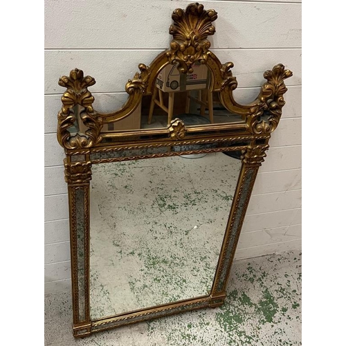 216 - A Louis XV style carved mirror 65cm x 127cm