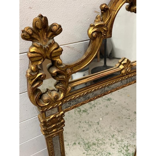 216 - A Louis XV style carved mirror 65cm x 127cm