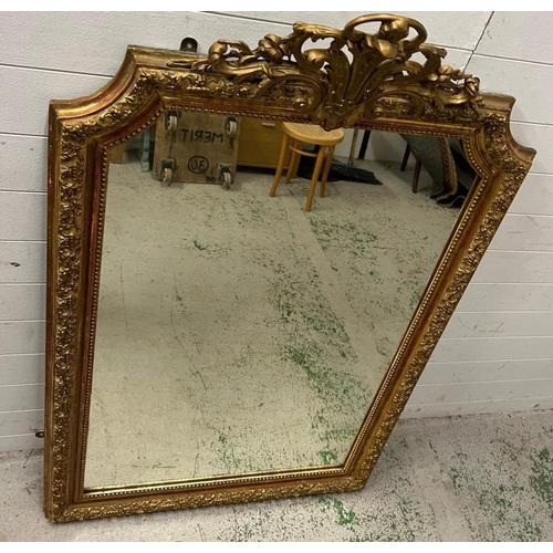 218 - A French giltwood mirror with scrolling crest, floral swags shaped mirror plate (150cm x 96cm)