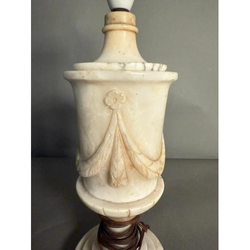 239 - A white marble table lamp with a central sash relief