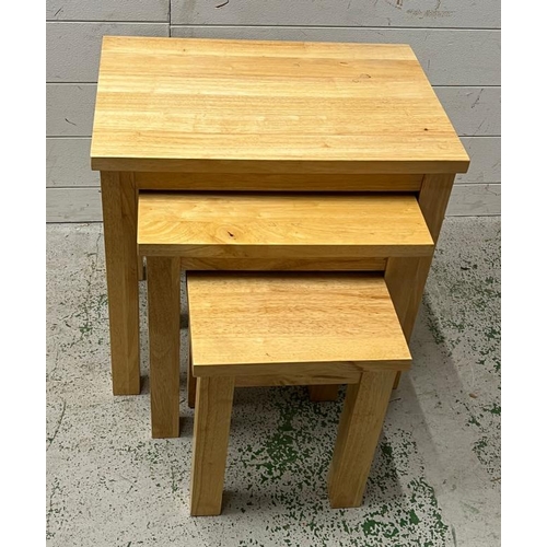 24 - A light oak nest of tables (H53cm W55cm D40cm)