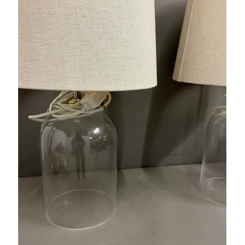 241 - Two contemporary glass table lamps with natural shades