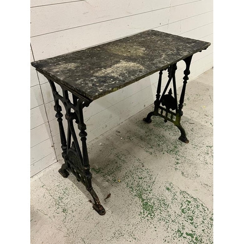 249 - A garden table with cast metal frame (92cm x 46cm)