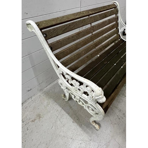 252 - A cast iron garden bench with slatted wooden seat (H77cm W104cm)