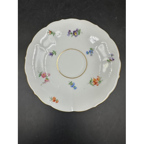 262 - A Meissen inkwell with floral design 14cm diameter.