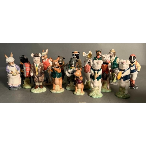 265 - A collection of Beswick figures to include a eight piece pig band