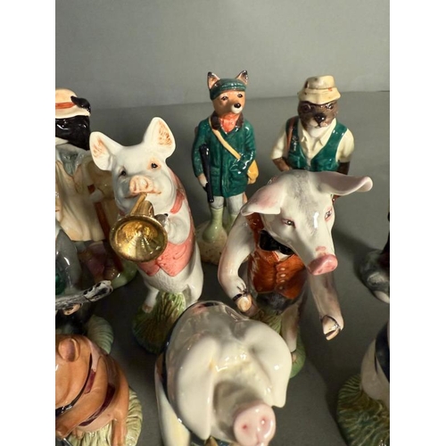 265 - A collection of Beswick figures to include a eight piece pig band