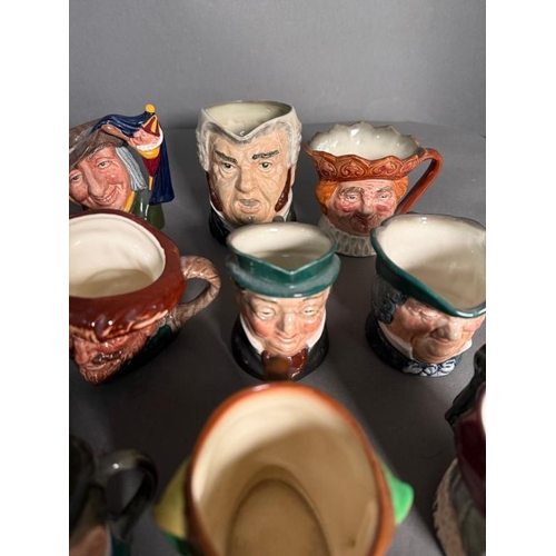 274 - A collection of miniature Royal Doulton character jugs to include Scaramouche, The Sailor and Guards... 