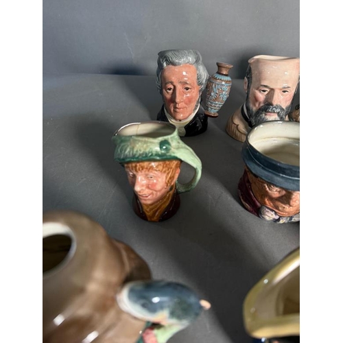 274 - A collection of miniature Royal Doulton character jugs to include Scaramouche, The Sailor and Guards... 