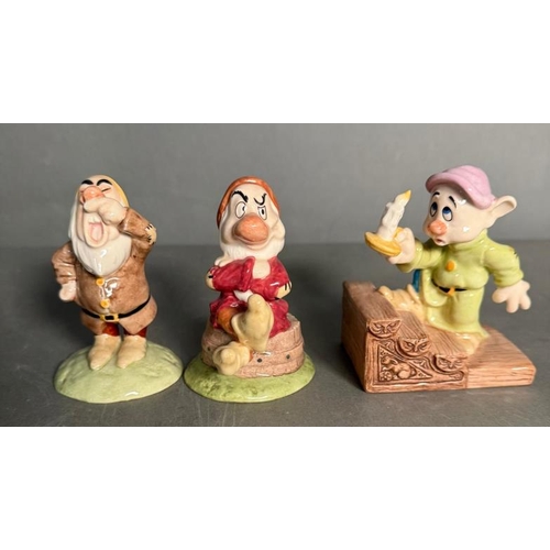 285 - A Royal Doulton Snow White and The Seven Dwarfs with an additional two dwarves