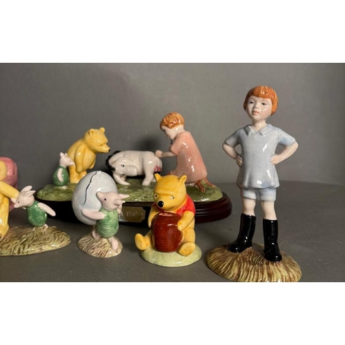 286 - A selection of Royal Doulton figures to include The Honeypot, Christopher Robin and Kanga and Roo