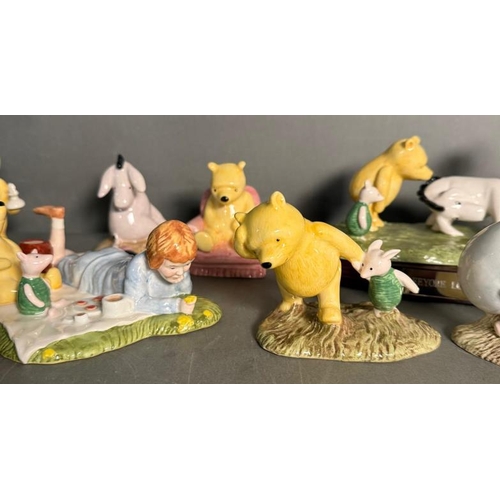 286 - A selection of Royal Doulton figures to include The Honeypot, Christopher Robin and Kanga and Roo