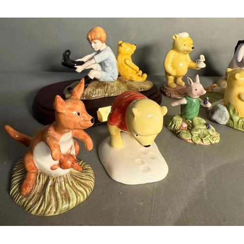 286 - A selection of Royal Doulton figures to include The Honeypot, Christopher Robin and Kanga and Roo