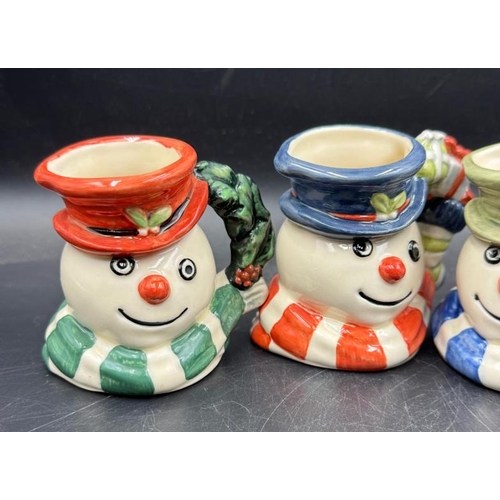 288 - Four Royal Doulton miniature Snowman character mugs