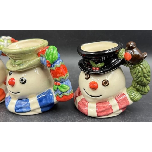 288 - Four Royal Doulton miniature Snowman character mugs