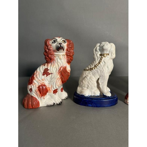 296 - A selection of Staffordshire spaniels in various colours