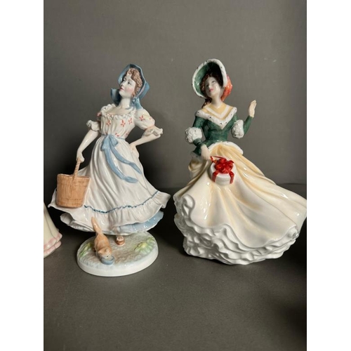 311 - Four Royal Doulton figures. Autumn, The Milkmaid, Christmas Day and Spring.