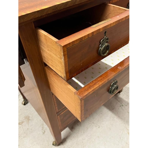 32 - An Edwardian mahogany chest of drawers with drop sides (Open H78cm W100cm D51cm)