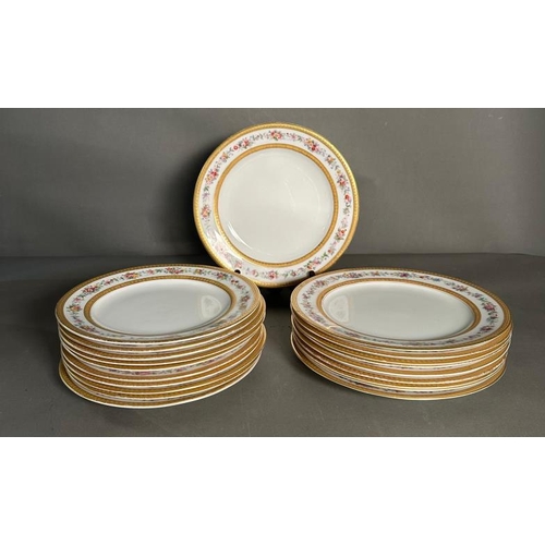 323 - A selection of Royal Worcester dinner plates with gilt and floral rims