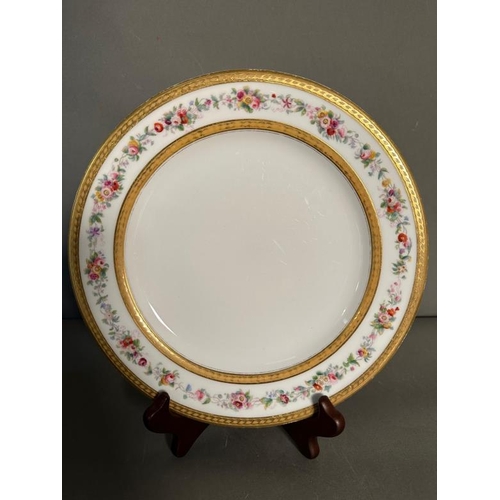 323 - A selection of Royal Worcester dinner plates with gilt and floral rims