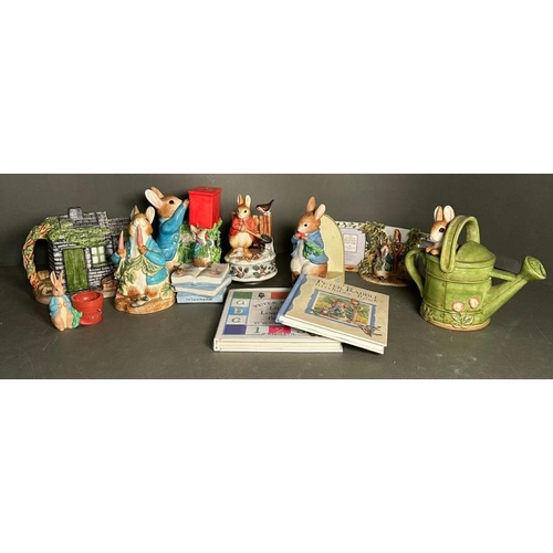 339 - A selection of Bextrix Potter Peter Rabbit collectable to include money boxes, books and a tea pot