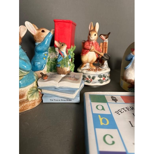 339 - A selection of Bextrix Potter Peter Rabbit collectable to include money boxes, books and a tea pot