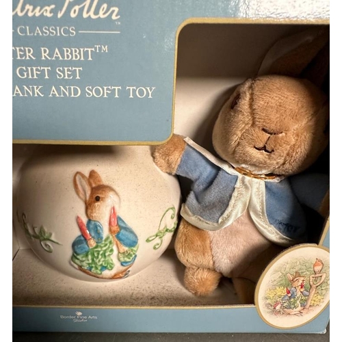 341 - A quantity of Beatrix Potter collectables to include money boxes, Wedgewood plates and cuddly toys