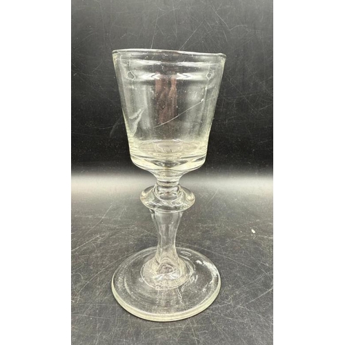 342 - An 18th Century Baluster wine glass, approximate height 148mm.