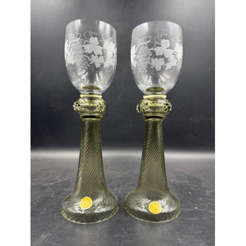 343 - A pair of Theresienthal wine glasses with etched grape vine design along with original stickers to b... 