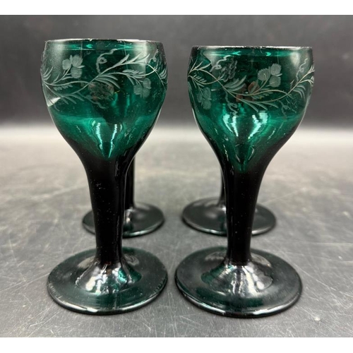 346 - Set of four Georgian, engraved green glasses, approximate height 11cm.