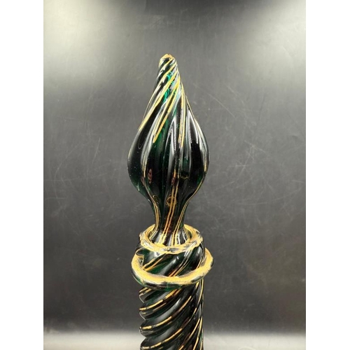 347 - A pair of green Continental Genie style glass decanters with gold detail and twisted design.