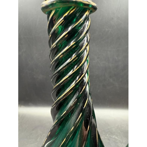 347 - A pair of green Continental Genie style glass decanters with gold detail and twisted design.