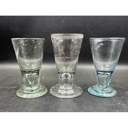 348 - Three 18th Century firing glasses one with German etched design