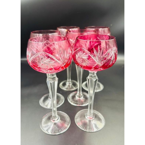 350 - A set of six cranberry cut glass hock or wine glasses