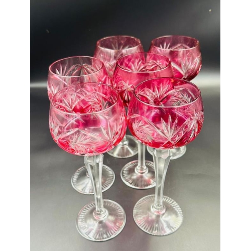 350 - A set of six cranberry cut glass hock or wine glasses