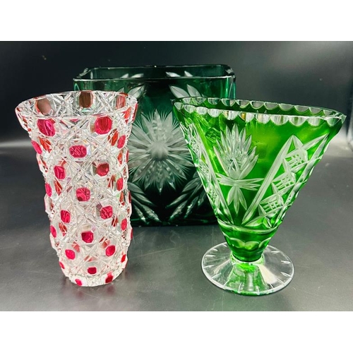 352 - A selection of three cut glass crystal vases, various styles and designs in green and cranberry.