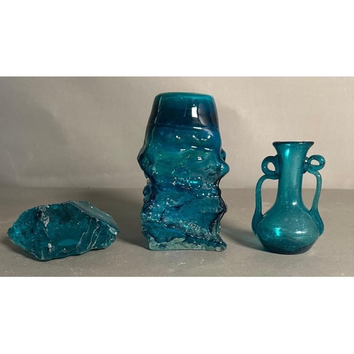 357 - A selection of blue glass some Mdina  to include a paperweight, urn and a bark vase