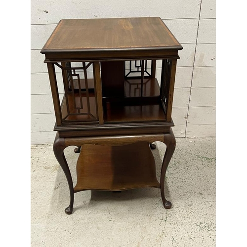 36 - An Edwardian mahogany revolving bookcase with four fretwork supports on four cabriole legs (H78cm Sq... 