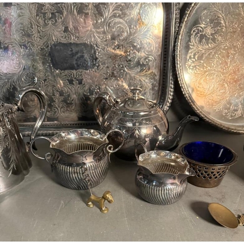 369 - A quantity of mixed metal items to include silver plate tea pots and trays and an early electric cop... 