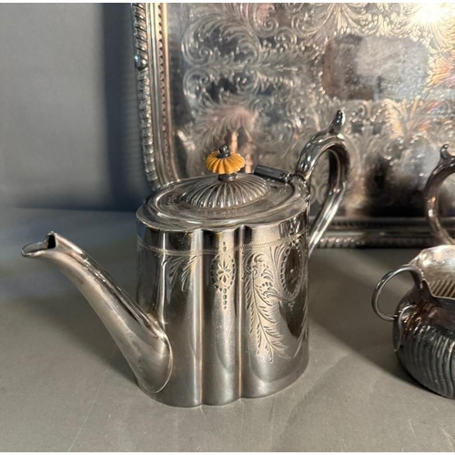 369 - A quantity of mixed metal items to include silver plate tea pots and trays and an early electric cop... 