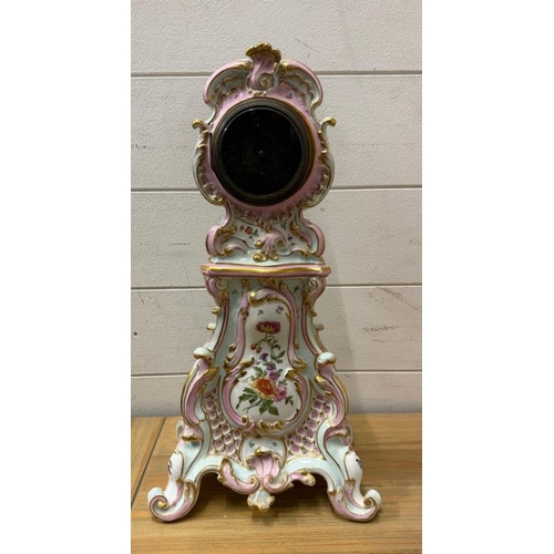 384 - A Dresden style ceramic mantle clock painted with a floral central shield and sides