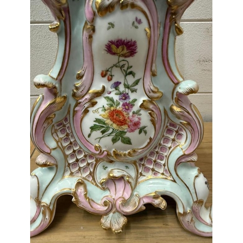 384 - A Dresden style ceramic mantle clock painted with a floral central shield and sides