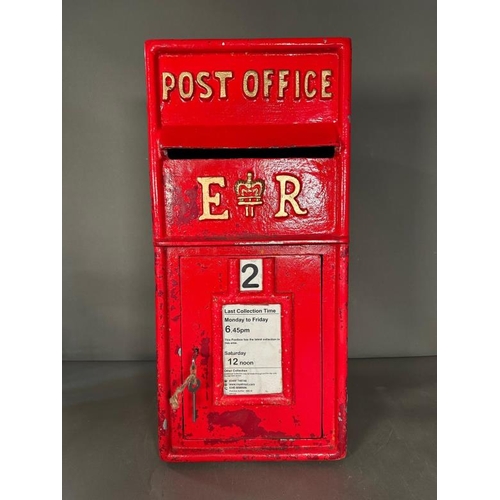 392 - A cast iron reproduction red post box with key