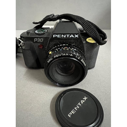 427 - A Pentax camera with flash