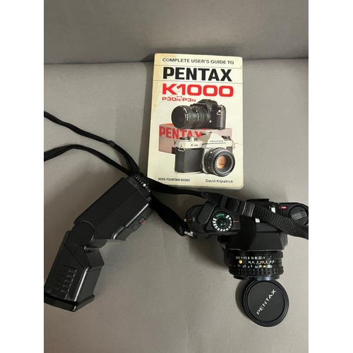 427 - A Pentax camera with flash