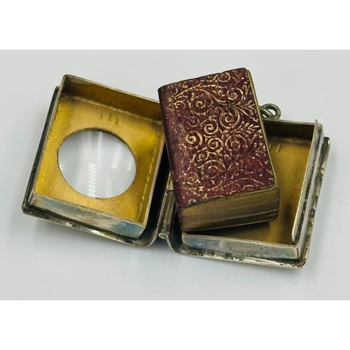 449 - A silver cased copy of the Koran