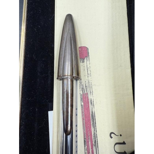 452 - A cased Bic silver capped biro