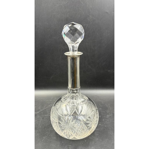 469 - A Continental silver necked cut glass decanter, marked 800 25cm H approximately.